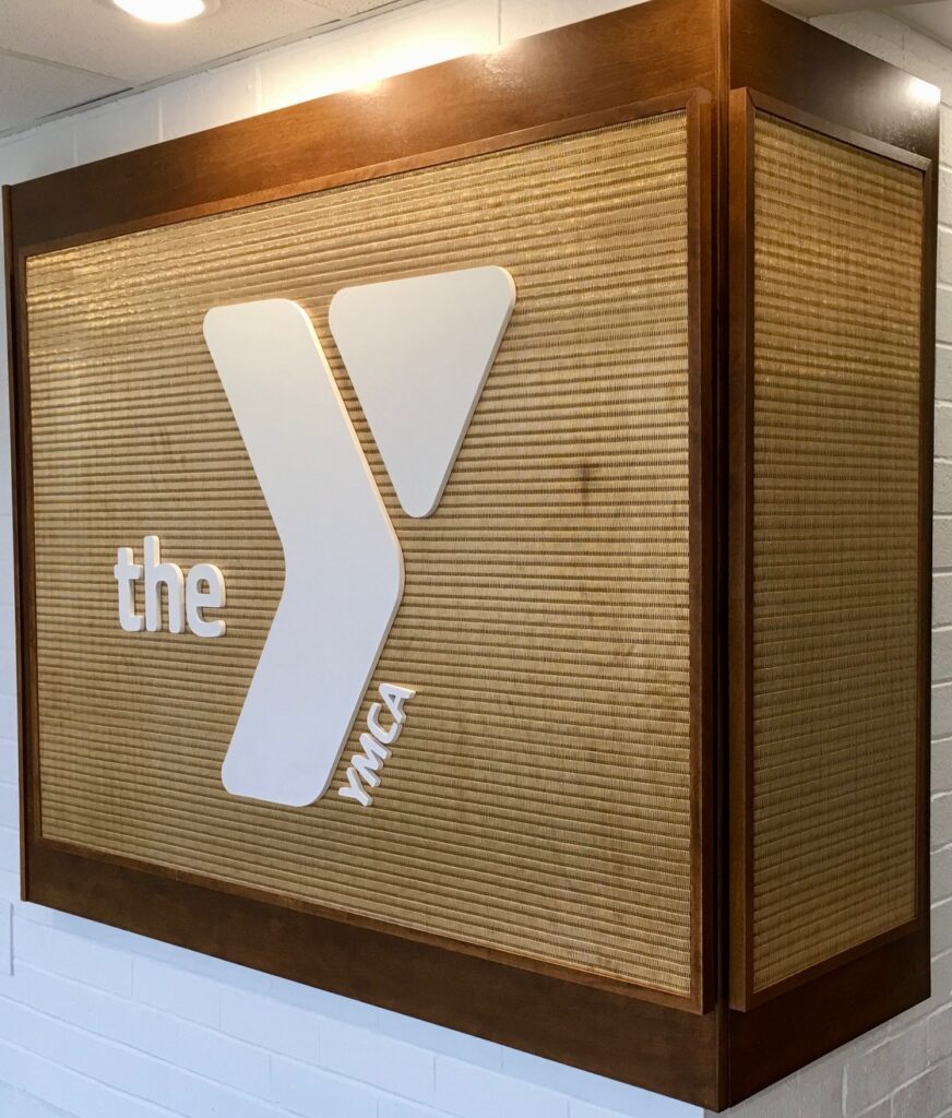 Stylized Wall with the YMCA Logo at the Downtown Louisville YMCA Lobby